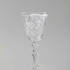Wine glass with a woman at a spinet