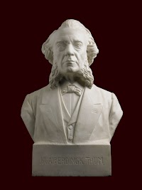 Buste van Josephus Albertus Alberdingk Thijm (1820-1889), katholiek letterkundige en handelsman en sokkel van zwart graniet met grijs mica.