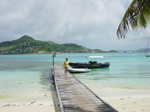 A dock on an overcast day on Petit St. Vincent (PSV) on Windward Island in the Grenadines.