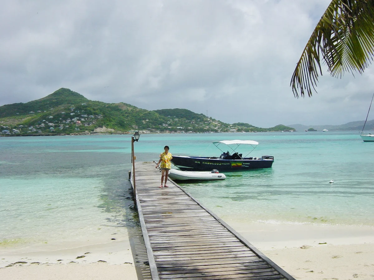 dock-st-vincent - A dock on an overcast day on Petit St. Vincent (PSV) on Windward Island in the Grenadines.