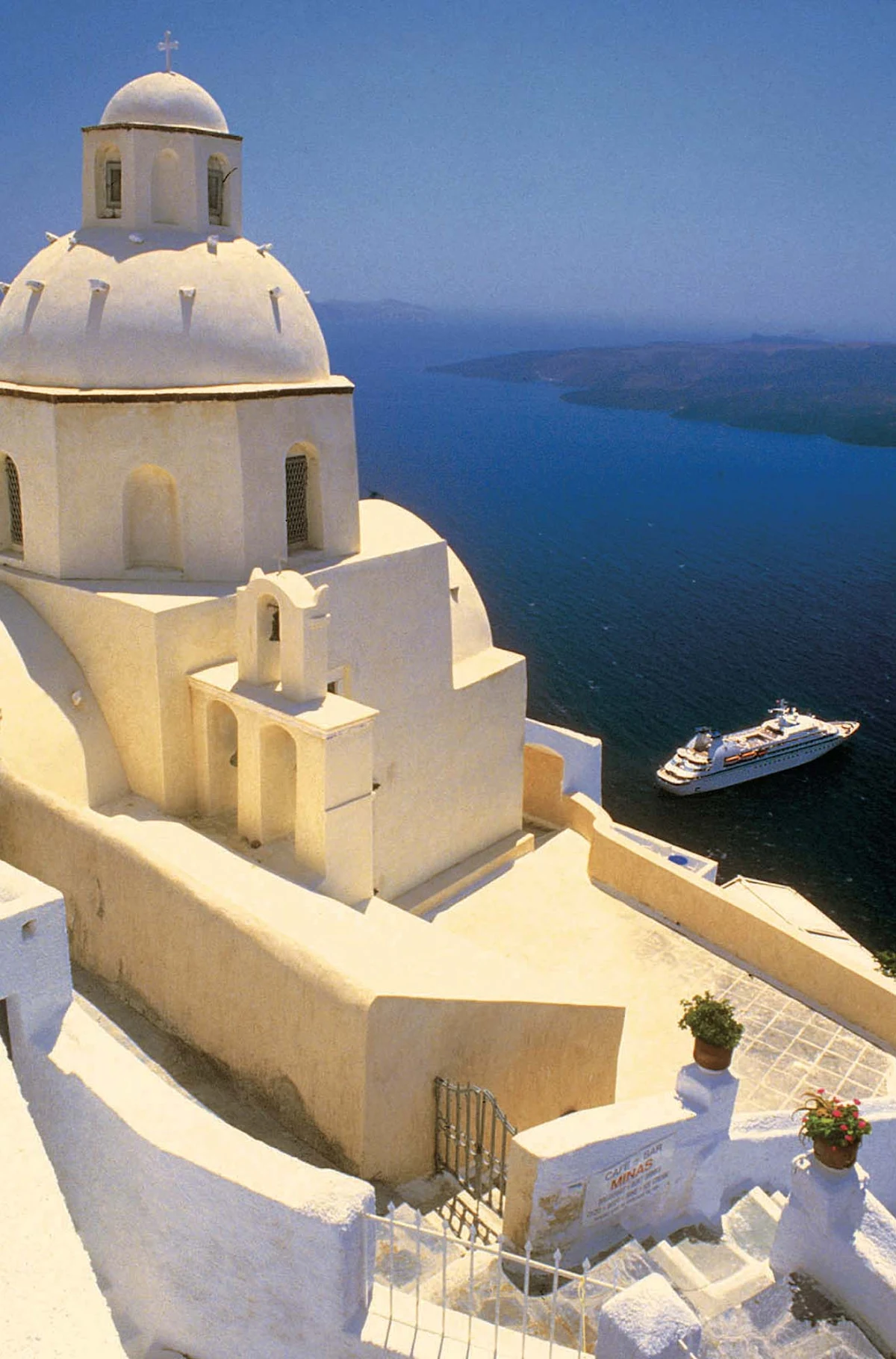 Seabourn_ship_in_Santorini_Greece - A Seabourn ship in the picture-postcard cruise haven of Santorini, Greece.