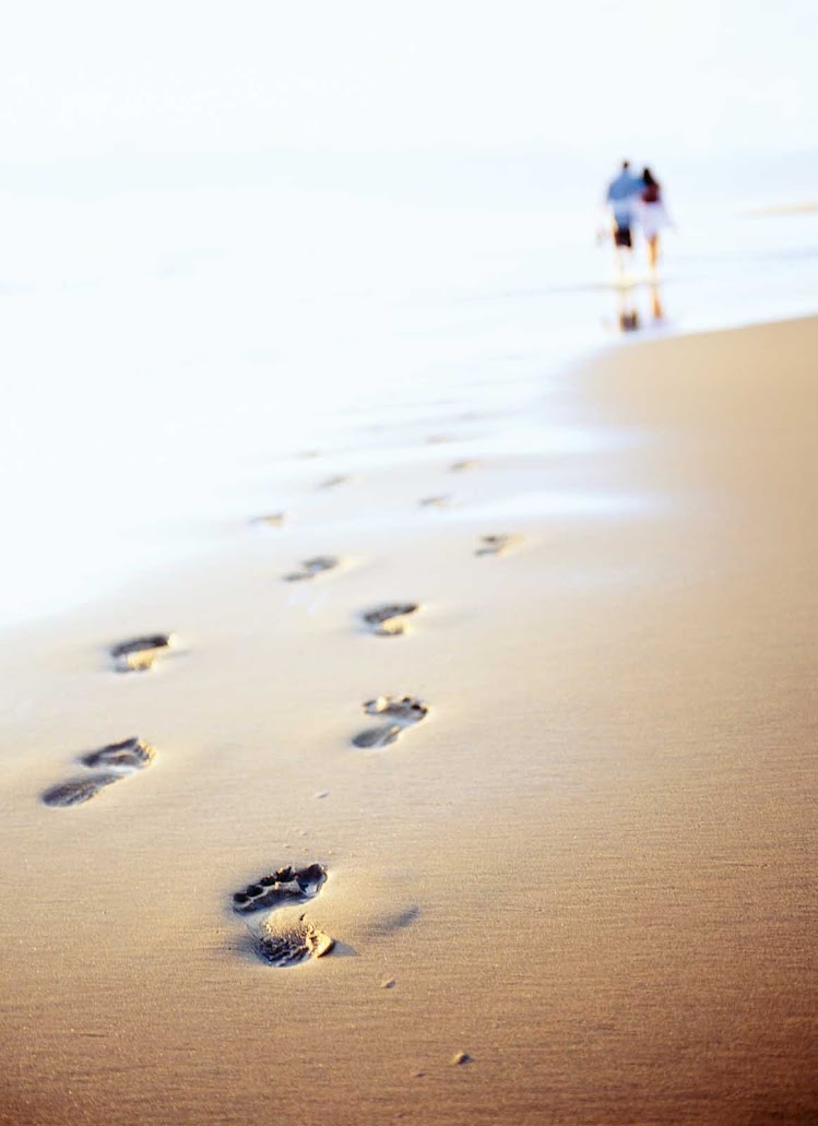 Take a romantic stroll on a tropical beach during a Windstar cruise.