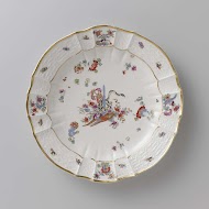 Rond bord, veelkleurig beschilderd met een Kakiemon-decor