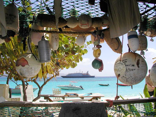 Grab a cool drink at a bar during a shore excursion in Jost Van Syke, British Virgin Islands, during your SeaDream sailing. 