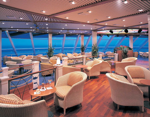 Whether set for a daytime conference or evening cocktails, the Observation Lounge on deck 12 of Norwegian Sun is a room with a view.