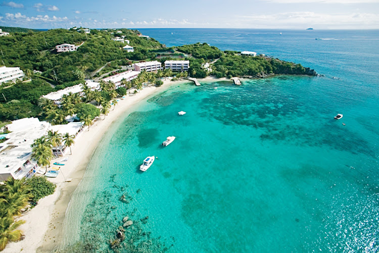 Boats are anchored in the bay near Secret Harbour on St. Thomas, US Virgin Islands.