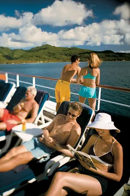 Bask in the Polynesian sunshine on the pool deck aboard the Paul Gauguin.